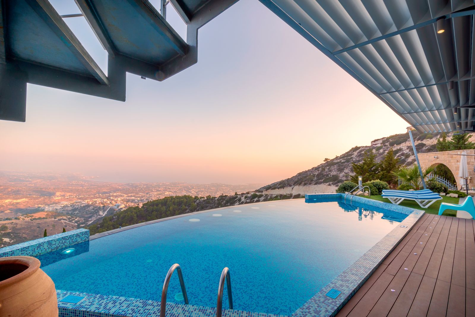 A stunning infinity-edge pool at sunset overlooking the Southern Utah hills